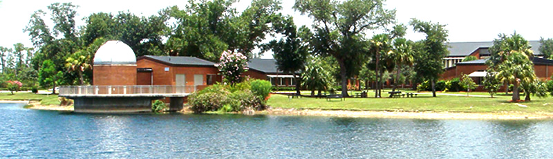 Charlotte campus observatory on the shore of the large lake at the Charlotte campus.